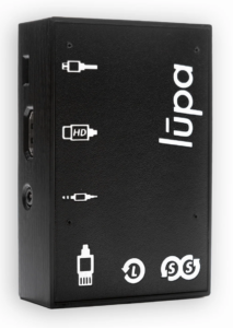 A top-down view of a compact, black Lupa digital media player with its logo printed vertically on the top surface, showing connection ports along its bottom edge.