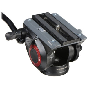 A close-up, angled view of a black Manfrotto 500A fluid tripod head, showing its quick-release camera mounting plate and a red safety release button on the side.