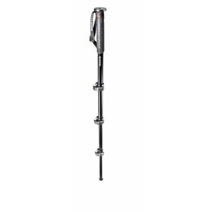 A professional black Manfrotto 4-section monopod standing vertically against a solid white background, showcasing its four leg extensions and flip-lock mechanisms.