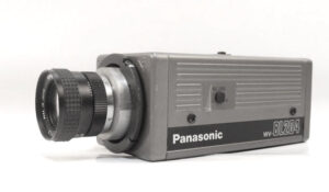 Vintage Panasonic WV-BL204 black and white CCTV surveillance camera with a silver lens, shown against a clean white background.