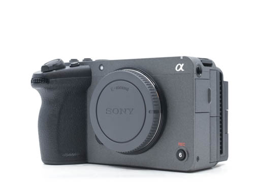 Close-up of a grey Sony FX30 Super 35 cinema camera body, showcasing its compact, modular body and top handle mounting points.